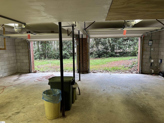 402 Chestnut St, Clinton, SC 29325 - garage with concrete block wall and a garage door opener