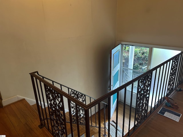 402 Chestnut St, Clinton, SC 29325 - stairway featuring baseboards and wood finished floors