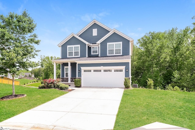 craftsman inspired home featuring a garage, a front lawn, stone siding, a porch, and driveway
