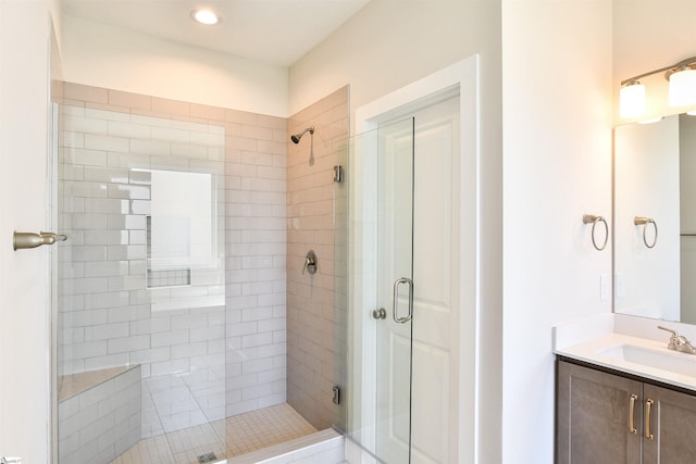 full bathroom featuring vanity and a stall shower