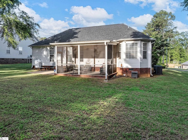 back of house with a yard, roof with shingles, central AC, and a sunroom