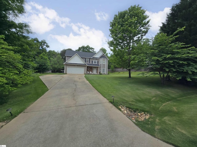 view of front facade featuring an attached garage, driveway, and a front yard