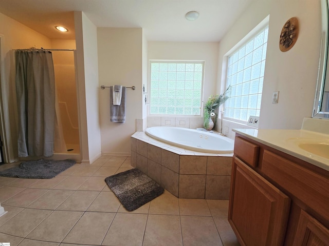 bathroom with vanity, tile patterned floors, a shower stall, and a bath