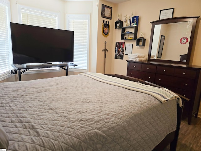 bedroom with wood finished floors