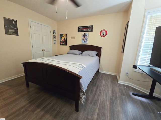 bedroom featuring baseboards, a ceiling fan, and dark wood finished floors