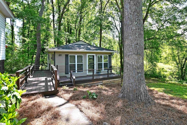 view of front of property with a wooden deck