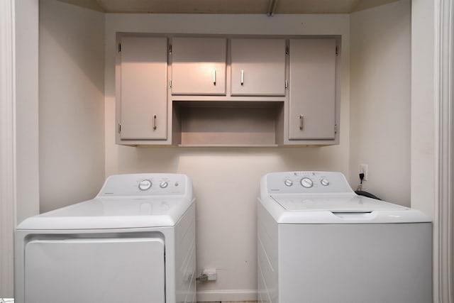 laundry area with cabinet space and washer and dryer