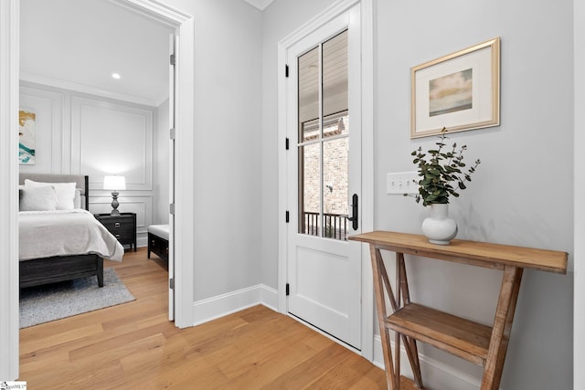 entryway featuring light wood-style floors and baseboards