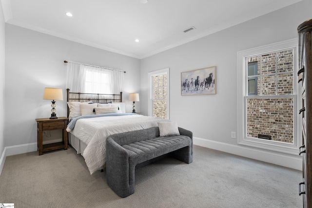 carpeted bedroom with baseboards, recessed lighting, crown molding, and visible vents