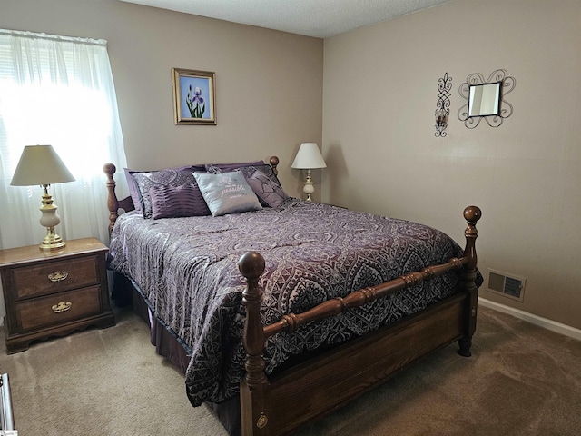 bedroom with baseboards, light carpet, and visible vents