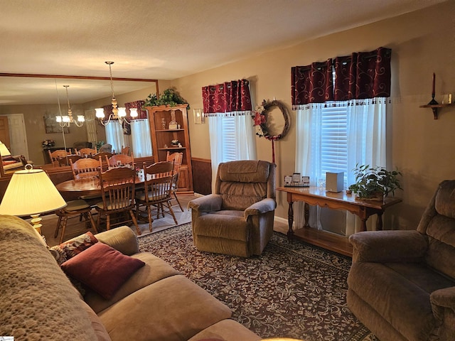living room featuring a notable chandelier