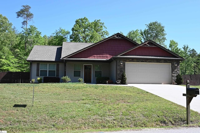 view of front of home featuring fence, an attached garage, stone siding, a front yard, and concrete driveway
