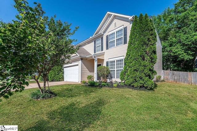traditional-style house featuring fence, an attached garage, concrete driveway, and a front yard