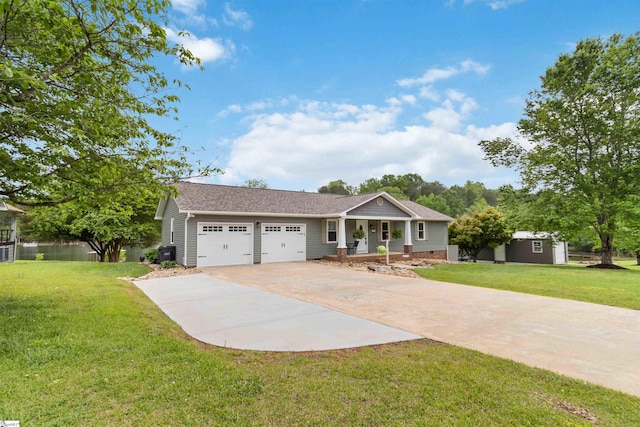 ranch-style home with covered porch, an attached garage, concrete driveway, and a front lawn