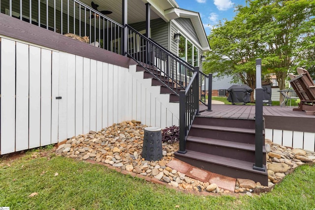 exterior space with area for grilling and stairs