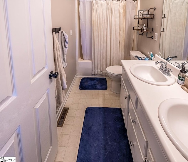 full bathroom with a sink, tile patterned flooring, double vanity, and visible vents