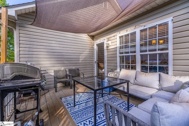 wooden deck with area for grilling and outdoor lounge area