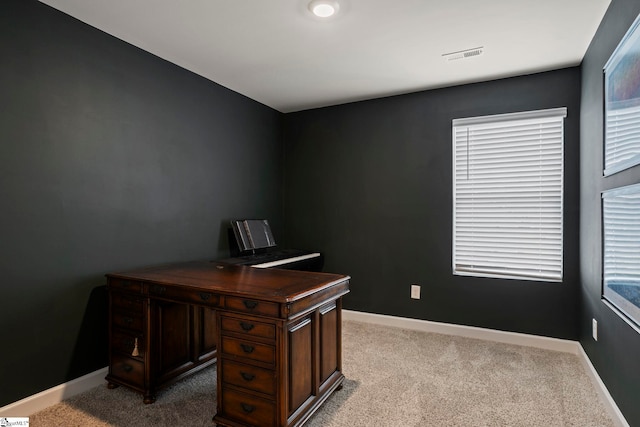 office area with baseboards, carpet flooring, and visible vents