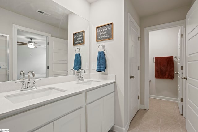 bathroom with ceiling fan, visible vents, a sink, and tile patterned floors