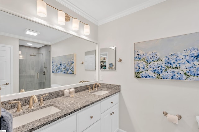 bathroom with crown molding, toilet, a shower stall, and a sink