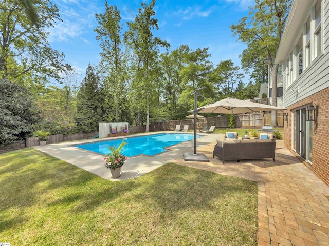 view of swimming pool featuring a patio area, a fenced in pool, a fenced backyard, an outdoor hangout area, and a yard