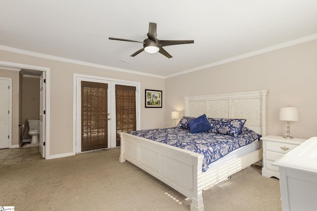 bedroom featuring a ceiling fan, crown molding, baseboards, ensuite bathroom, and light carpet