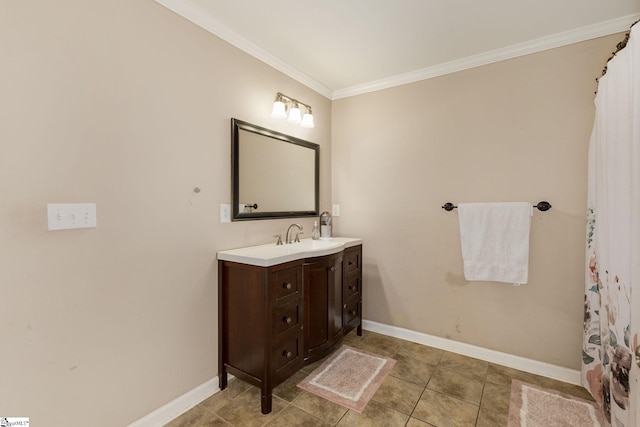 bathroom featuring baseboards, ornamental molding, tile patterned floors, and vanity
