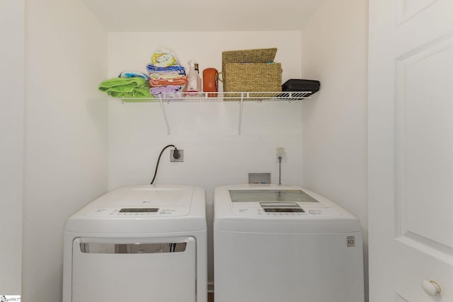 laundry area featuring laundry area and independent washer and dryer