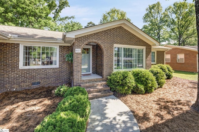 view of front of house with brick siding