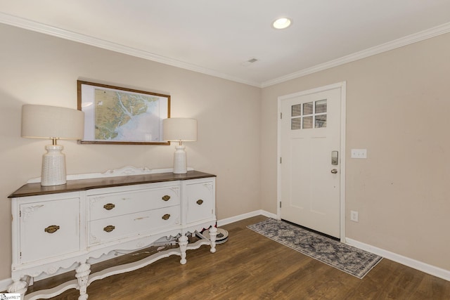 entrance foyer featuring baseboards, ornamental molding, dark wood finished floors, and recessed lighting