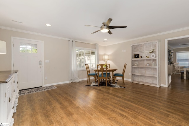 dining room featuring ornamental molding, a ceiling fan, wood finished floors, and visible vents