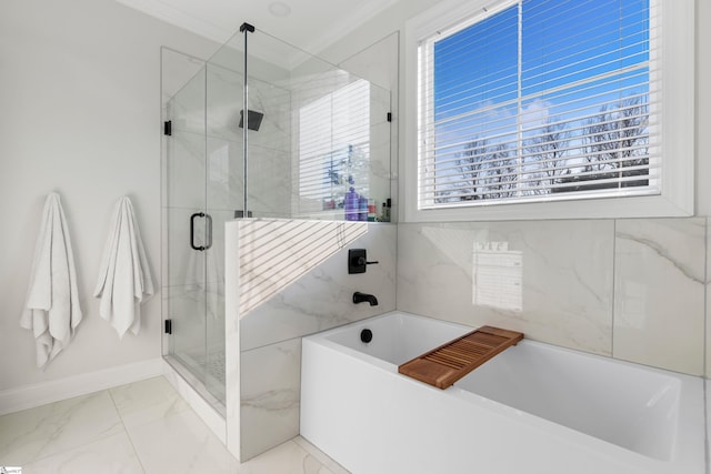 full bath featuring a bath, a shower stall, baseboards, marble finish floor, and ornamental molding