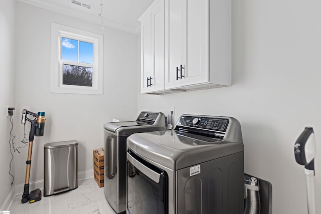 laundry room with visible vents, cabinet space, baseboards, marble finish floor, and separate washer and dryer