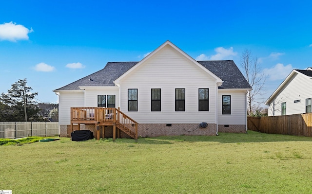 rear view of house with a lawn, a fenced backyard, stairway, and crawl space