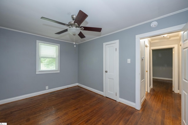unfurnished bedroom with ceiling fan, visible vents, crown molding, wood finished floors, and baseboards