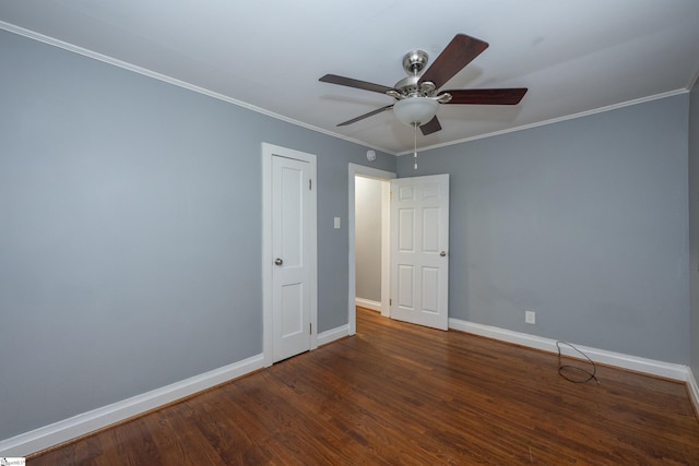 unfurnished bedroom featuring baseboards, a ceiling fan, crown molding, and wood finished floors
