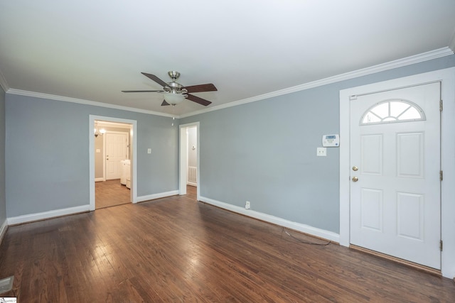 foyer entrance with crown molding, a ceiling fan, and wood finished floors
