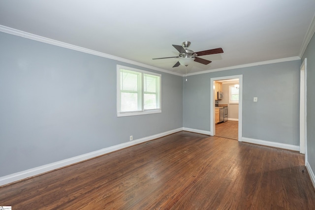 unfurnished bedroom with baseboards, ornamental molding, dark wood finished floors, and a ceiling fan