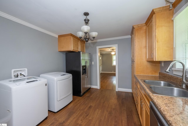 washroom with laundry area, a sink, separate washer and dryer, baseboards, and dark wood-style floors