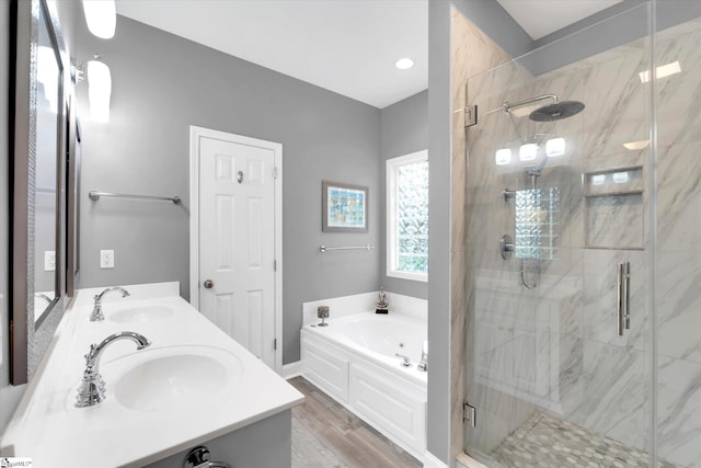 bathroom with a sink, a stall shower, and a bath