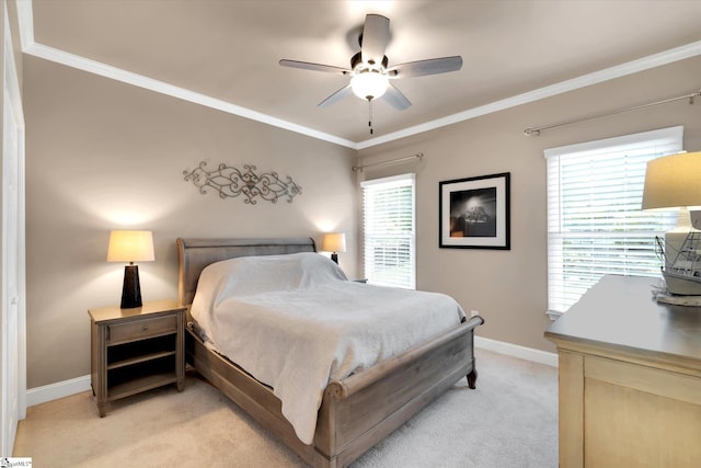 bedroom featuring crown molding, baseboards, and light colored carpet