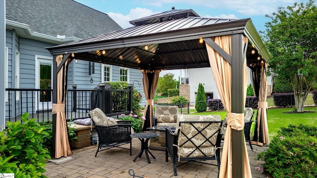 view of patio with a gazebo and an outdoor living space