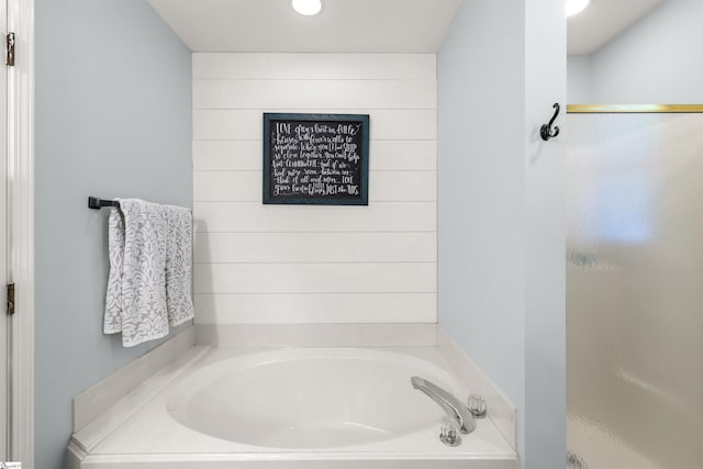 full bath with a shower stall and a bath