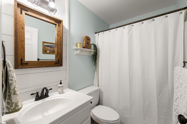full bathroom featuring toilet and vanity