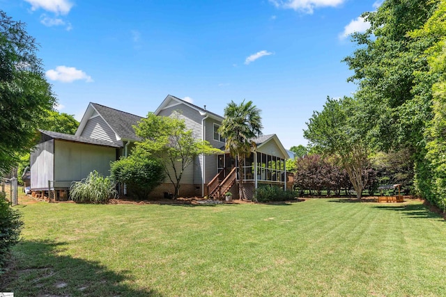 view of yard featuring a sunroom