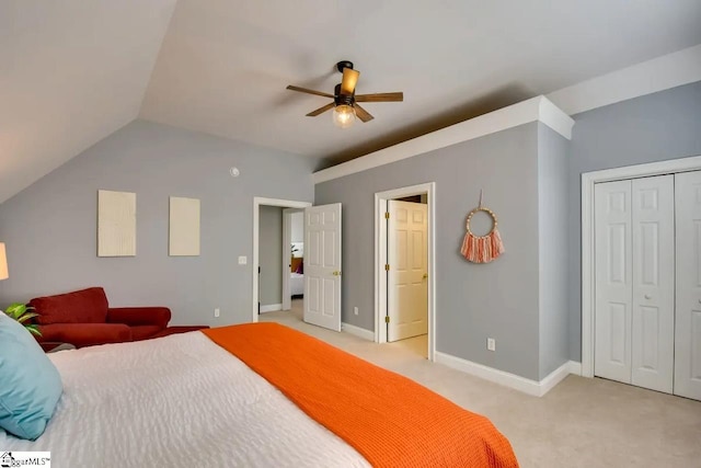 bedroom featuring light colored carpet, baseboards, vaulted ceiling, and ceiling fan
