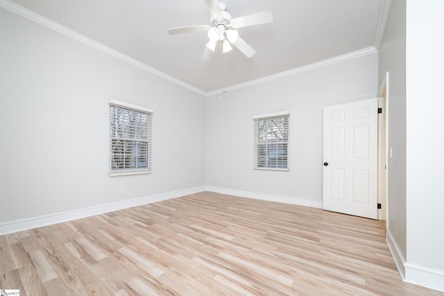 spare room featuring crown molding, a ceiling fan, baseboards, and light wood finished floors
