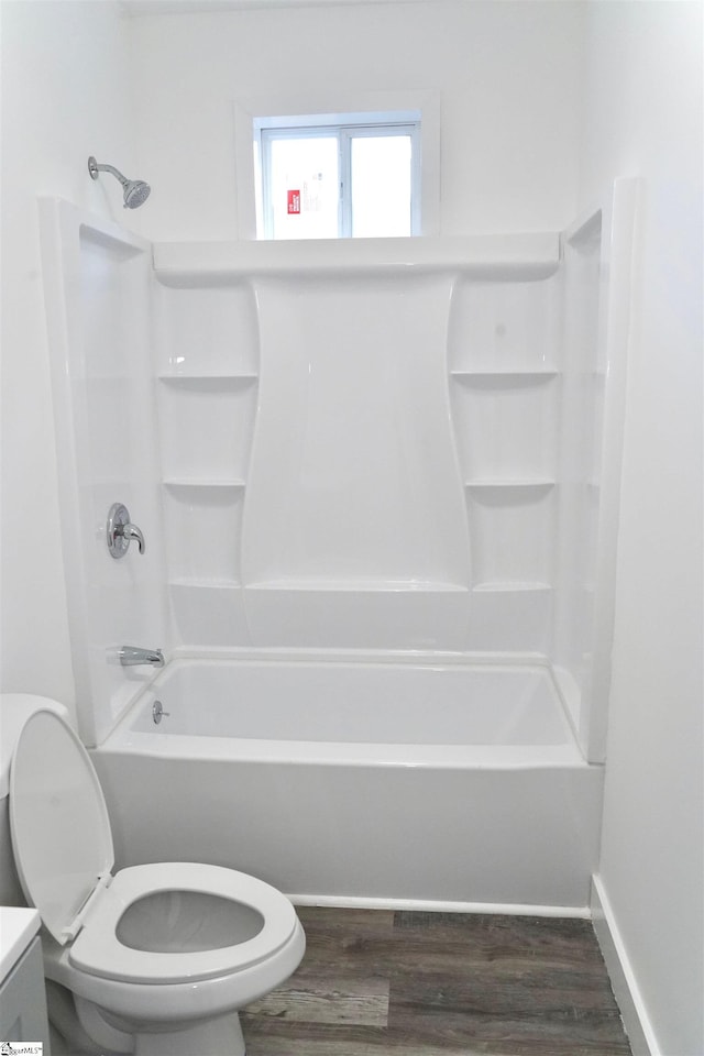 full bathroom with vanity, shower / bathtub combination, wood finished floors, and toilet