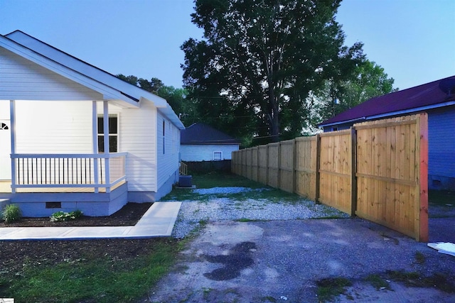 view of home's exterior featuring fence and crawl space