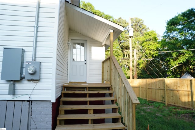 view of exterior entry with fence